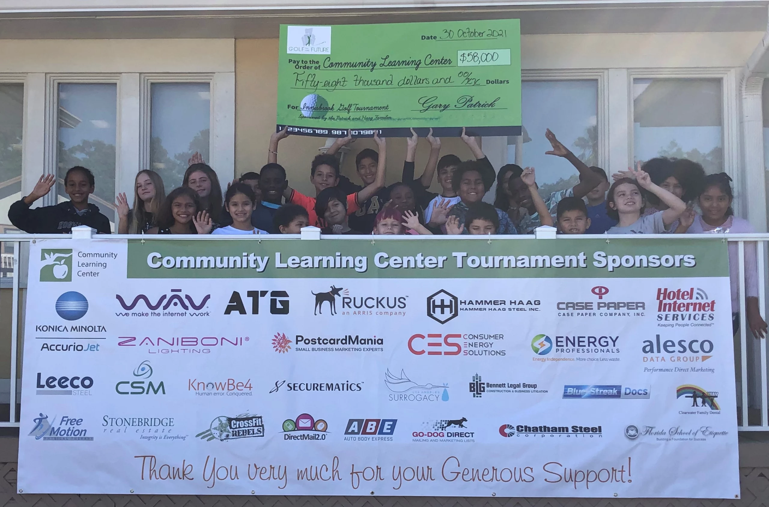 community learning center clearwater students with 2021 golf tournament check